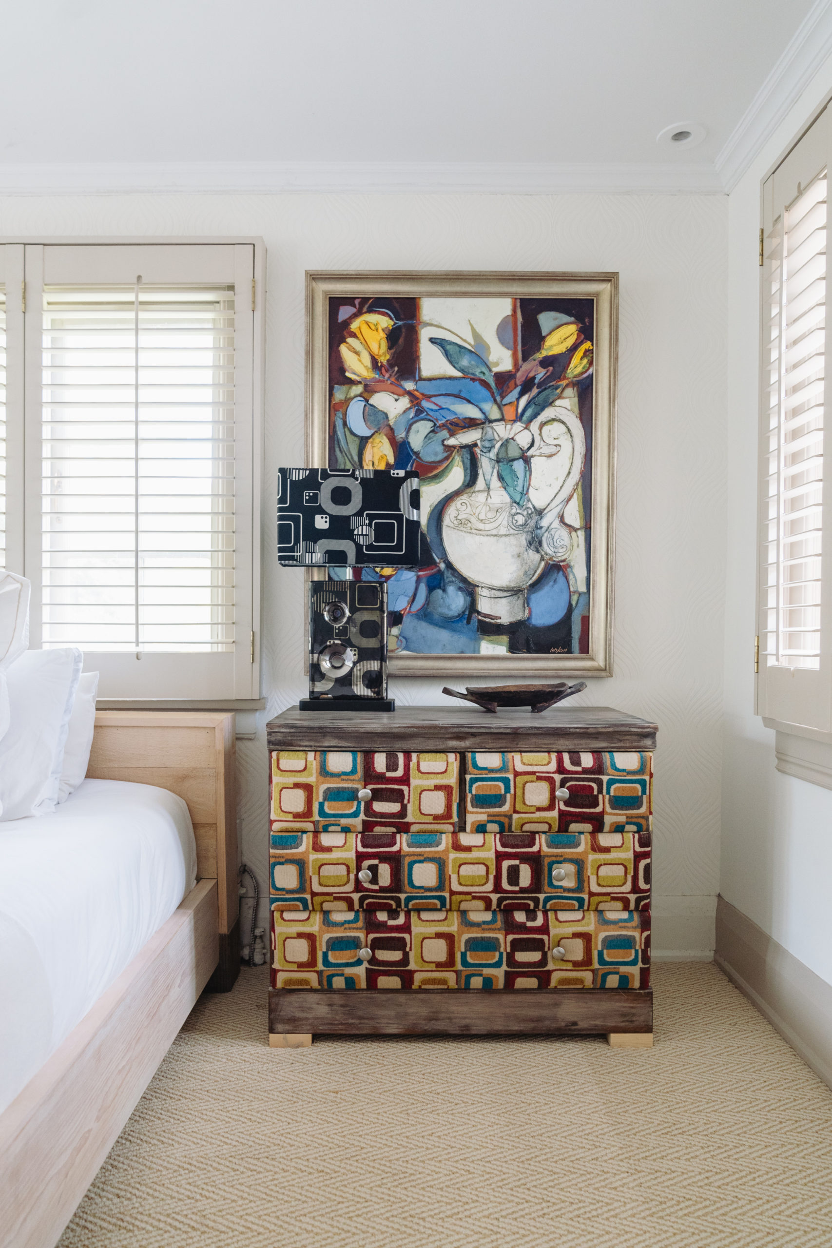 Lipkin stained this old pine dresser and upholstered the front in an earthy fabric. The painting is by Aileen Lipkin, who was a prominent South African artist.
