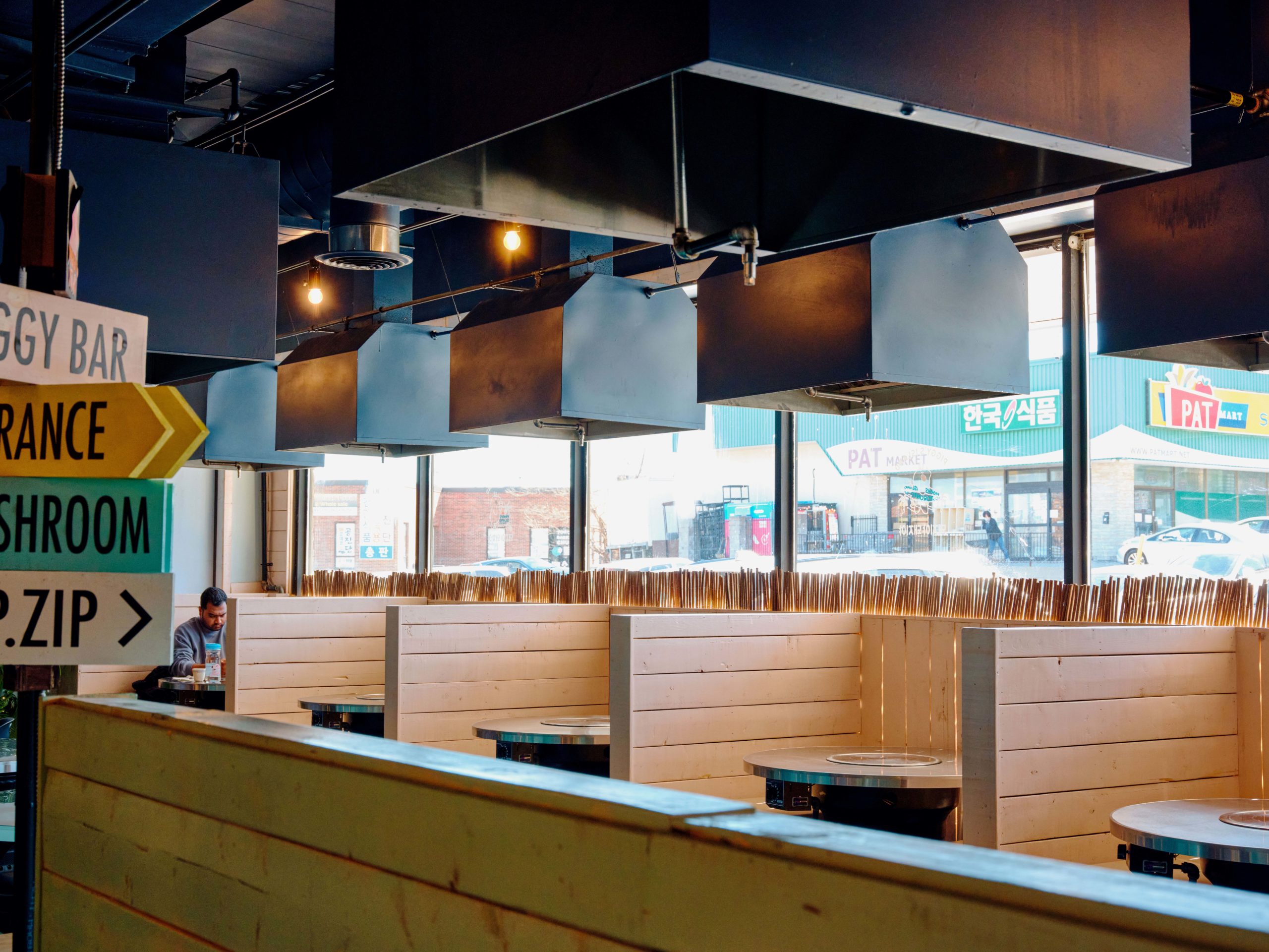 Booth seating at Piggy's Island, a Korean barbecue restaurant in Thornhill